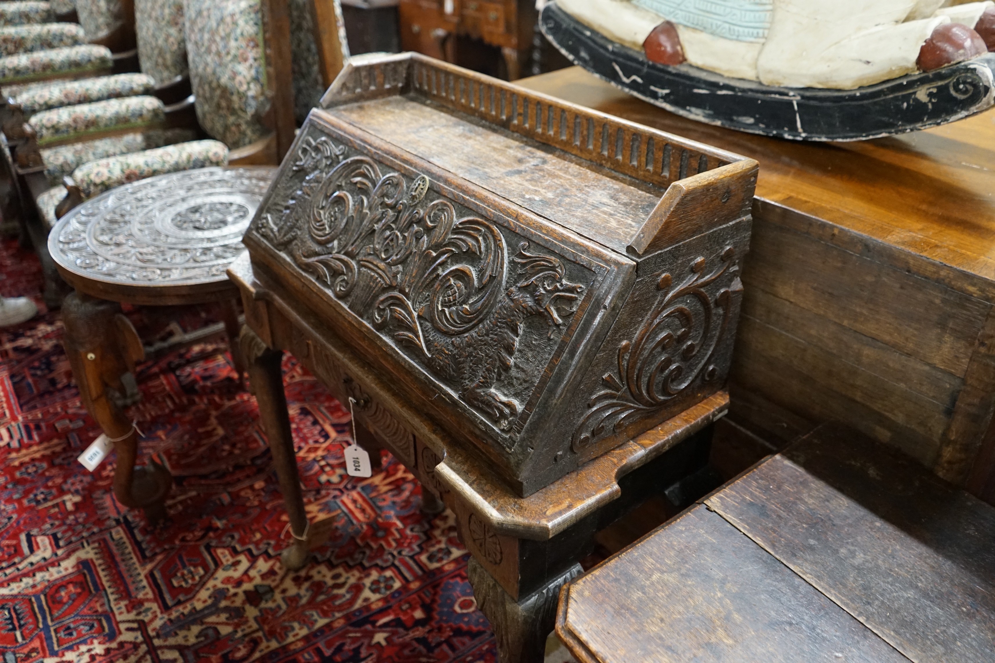 An 18th century style carved oak bureau, width 79cm, depth 36cm, height 99cm